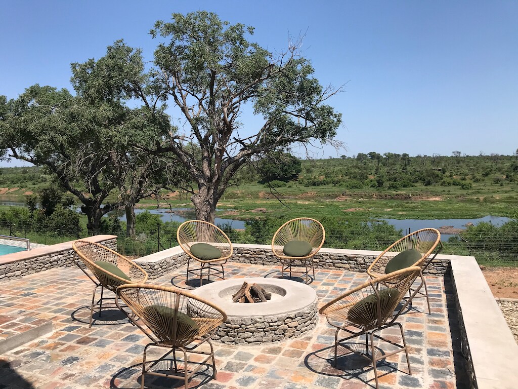 Boma area with wicker chairs around the fire