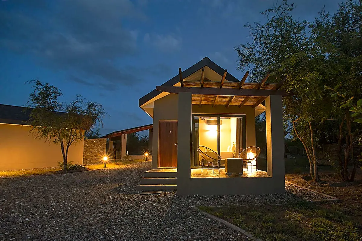 Private cottage exterior lit at night