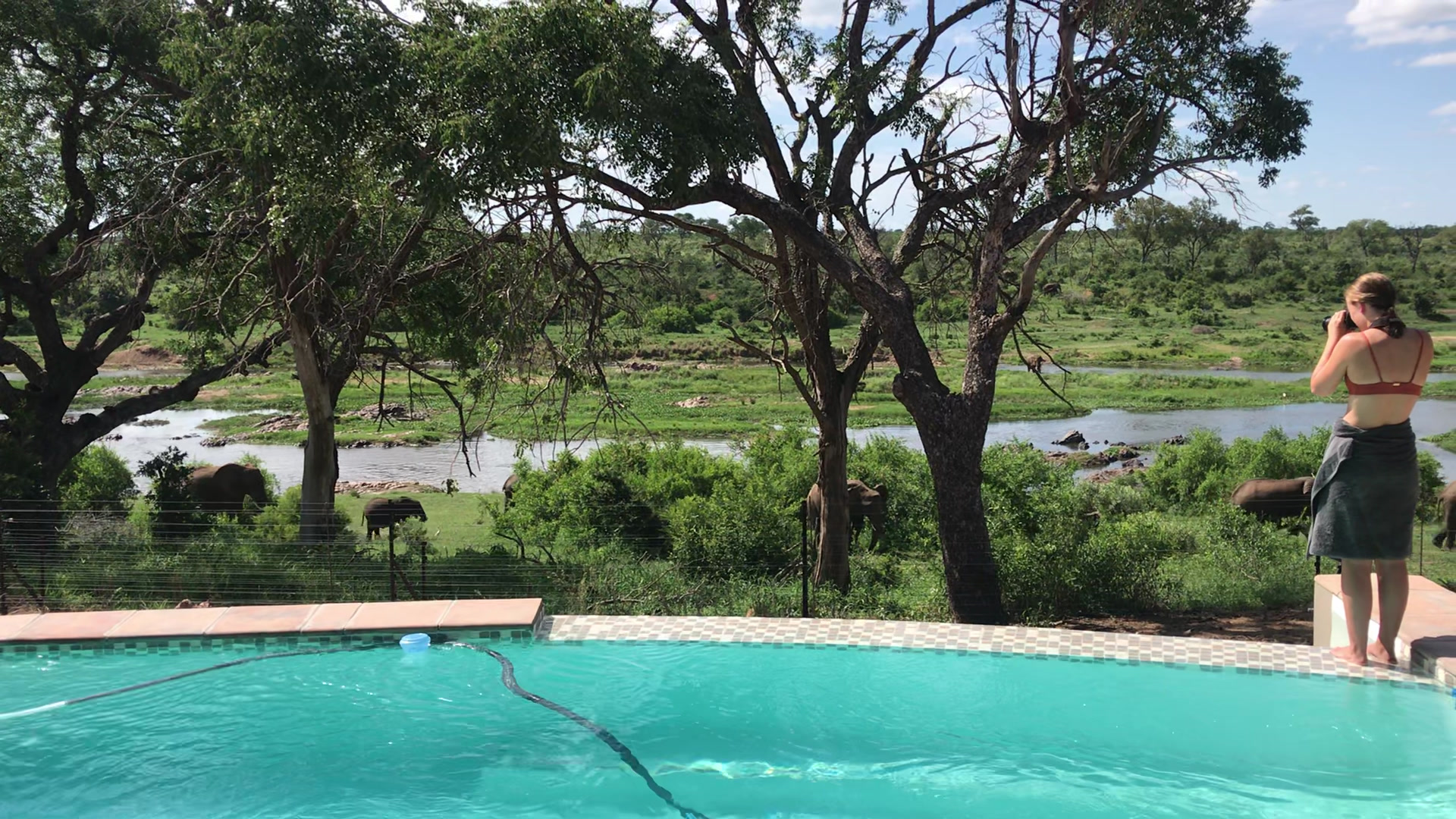 Guest relaxing at the infinity pool